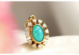 Opal & Halo Diamonds Pendant in 18K Yellow Gold
