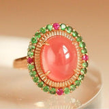 6.5ct Rhodochrosite Cabochon Cut & Halo Tourmaline Ring in 18K Gold