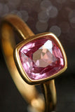 1.1ct Pinkish Cushion Bezal Set Ring in 18K Yellow Gold