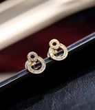 Circle Design Baguette White Diamond Earrings in 18K Yellow Gold