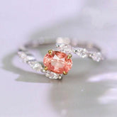 Padparadscha Sapphire Oval 18K Gold Ring with Bypass Diamond Design