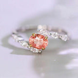 Padparadscha Sapphire Oval 18K Gold Ring with Bypass Diamond Design