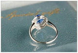 Blue Sapphire & Halo Diamonds Ring - 18K White Gold