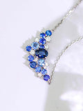 Blue Sapphire & Diamond Cluster Necklace in 18K White Gold