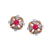 A pair of elegant earrings with a pink gemstone in the center, surrounded by a decorative design of diamonds and gold.