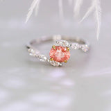 Padparadscha Sapphire Oval 18K Gold Ring with Bypass Diamond Design