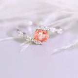 Padparadscha Sapphire Oval 18K Gold Ring with Bypass Diamond Design