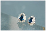 Blue Sapphire & Halo Diamond Studs in 18K White Gold