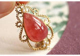 Rhodochrosite 12x17mm & Akoya Baby Pearl Pendant in 18K Yellow Gold