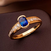 Channel Set Half Bezel Sapphire Eternity Ring in 18K Yellow Gold