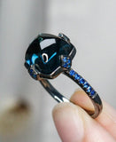 7.7ct Sugarloaf Blue Topaz Ring in 18K Black Gold Ring