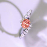 Padparadscha Sapphire Oval 18K Gold Ring with Bypass Diamond Design