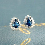 Blue Sapphire & Halo Diamond Studs in 18K White Gold