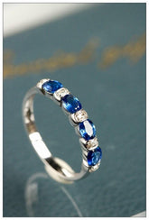 Four Blue Sapphire & Chaneel Diamond Ring in 18K White Gold