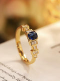 Art Deco Royal Sapphire Ring in 18K Gold with Princess-Cut Diamonds
