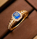 Emerald Cut Blue Sapphire & Diamonds Ring in 18K Yellow Gold