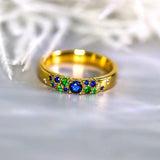 Blue Sapphire Tsavorite Cluster Band Ring in 18K Yellow Gold