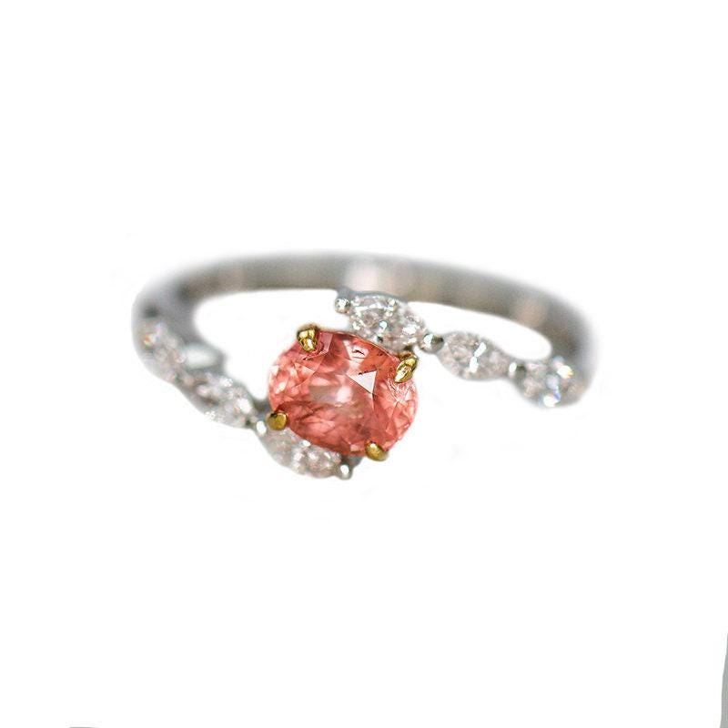 Padparadscha Sapphire Oval 18K Gold Ring with Bypass Diamond Design