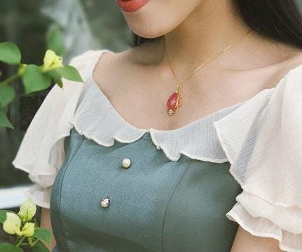Rhodochrosite 12x17mm & Akoya Baby Pearl Pendant in 18K Yellow Gold