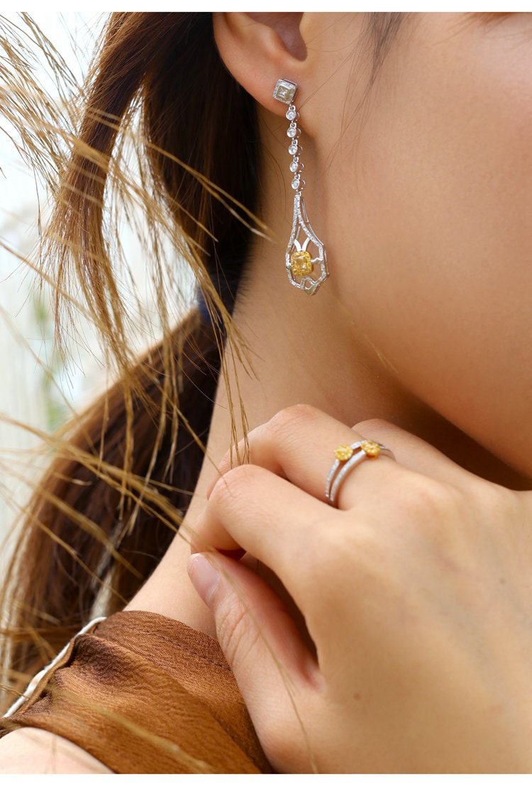 Two Fancy Yellow Diamonds Oval Ring in 18K Yellow Gold