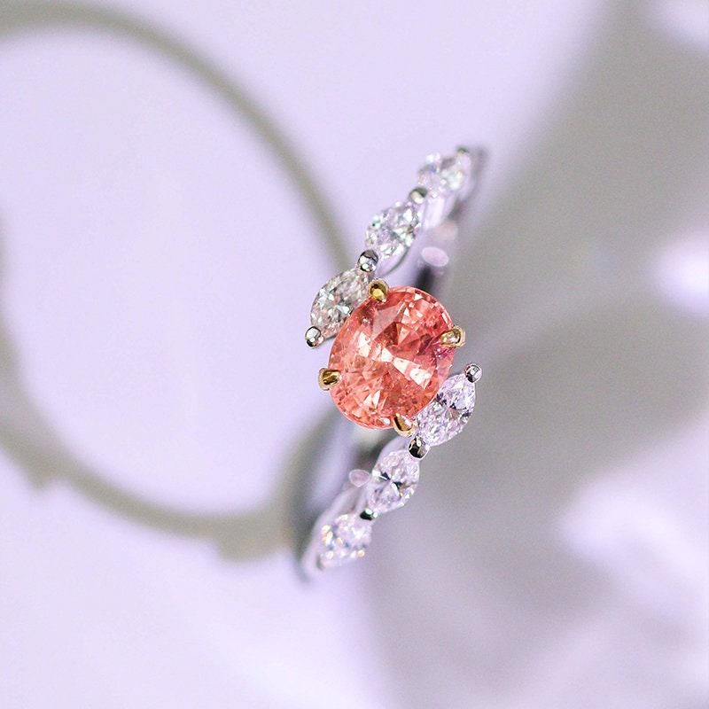 Padparadscha Sapphire Oval 18K Gold Ring with Bypass Diamond Design