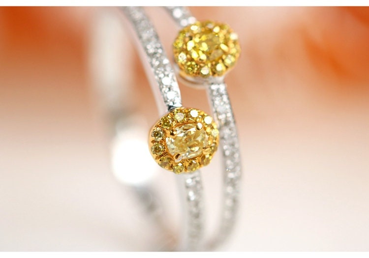 Two Fancy Yellow Diamonds Oval Ring in 18K Yellow Gold