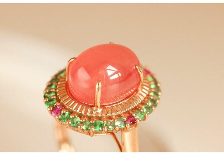 6.5ct Rhodochrosite Cabochon Cut & Halo Tourmaline Ring in 18K Gold